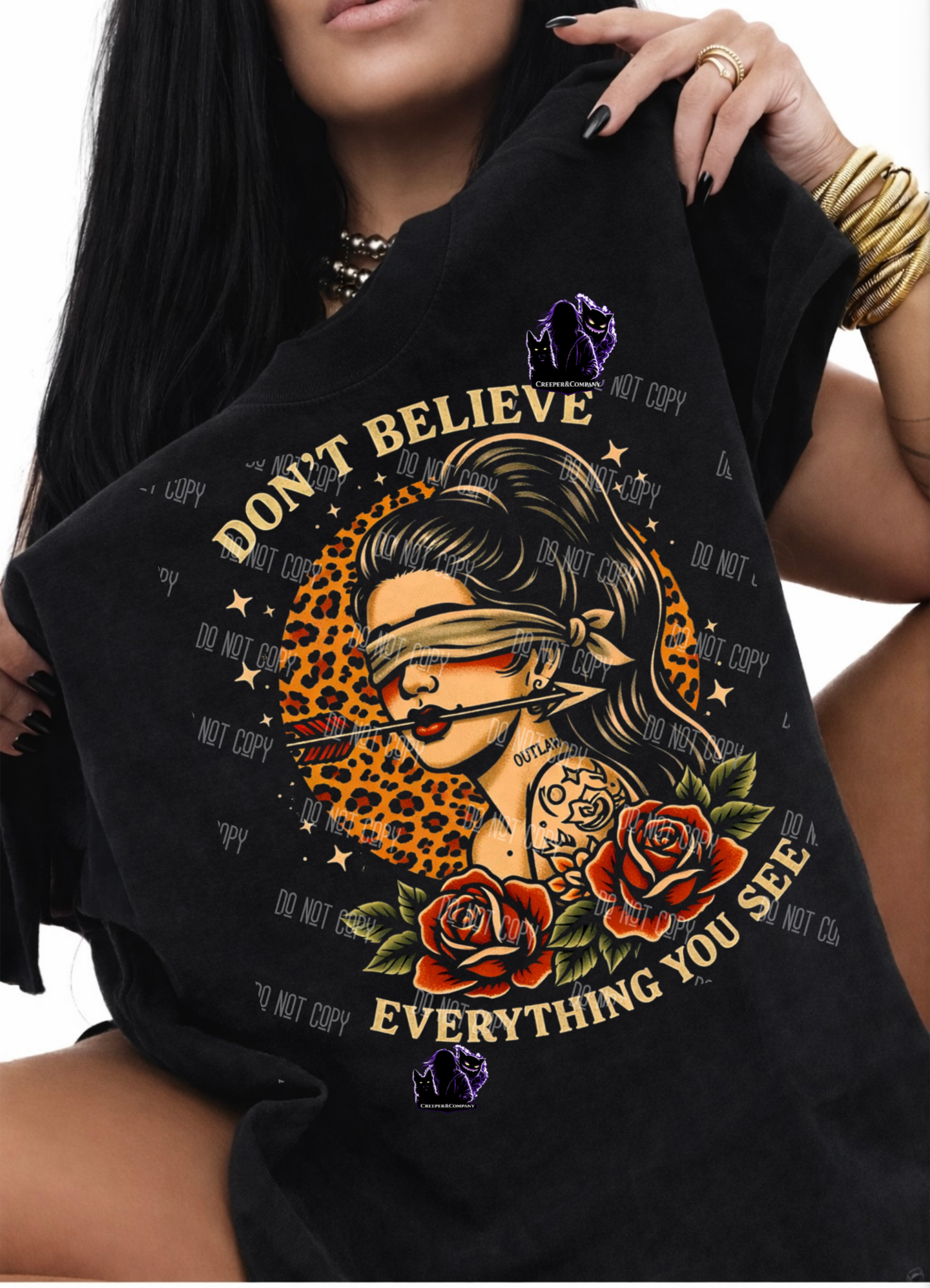 Don’t Believe Everything You See – Blindfolded Rebel Graphic Tee